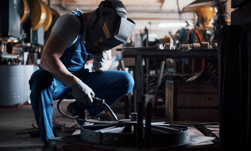 portrait-of-a-young-worker-at-a-large-metalworking-plant-the-welder-engineer-works-in-a-protective-1.jpg